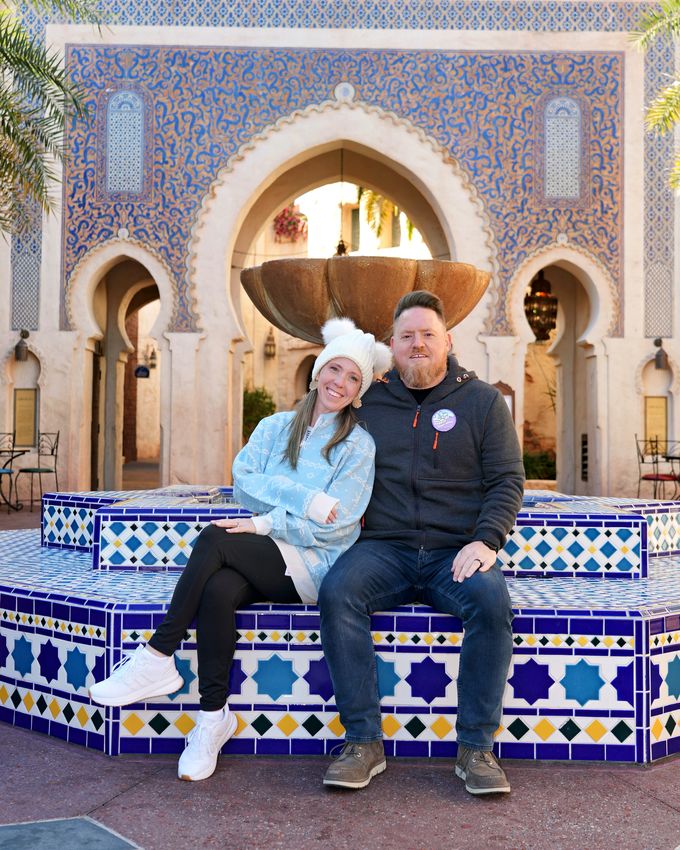 Lynne and her husband at the Morocco pavilion fountain in EPCOT's World Showcase
