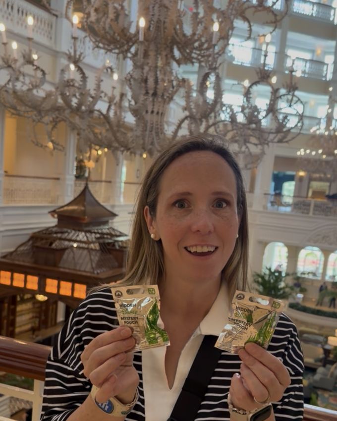 Lynne holding two hidden Disney mystery pouches